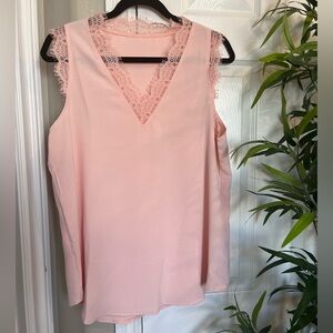 NWOT Sleeveless v-neck blouse with lace details